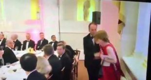 Conservative MP Mark Field shoves a #climateEmergency protestor against a pillar then grabs her neck