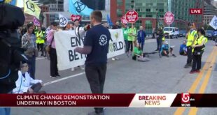 Climate change activists block busy Boston bridge